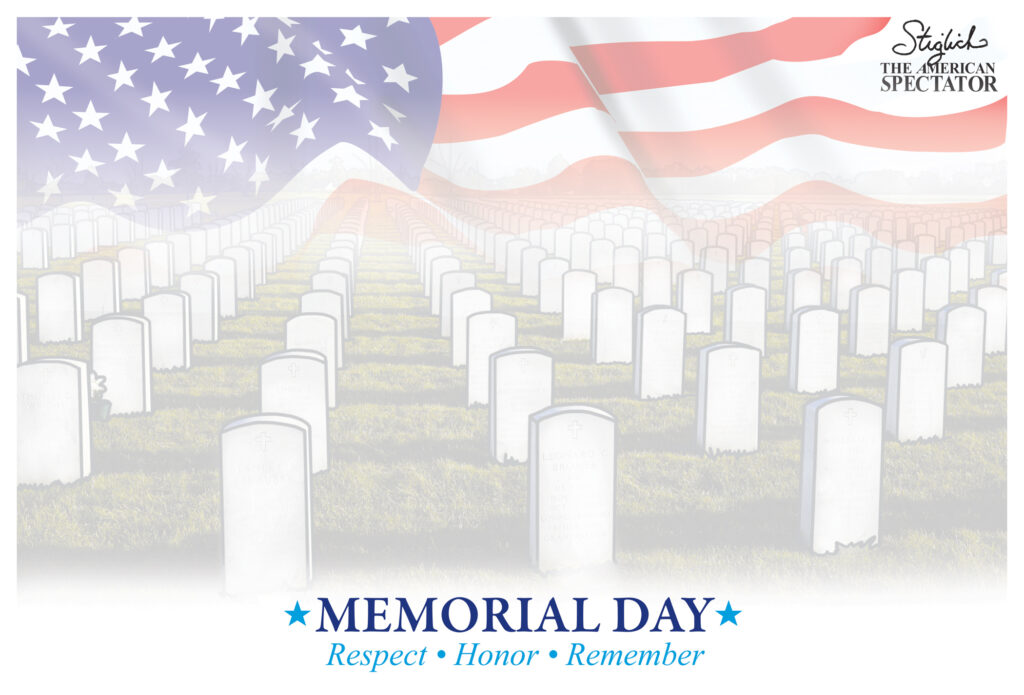 American flag over military cemetery headstones
