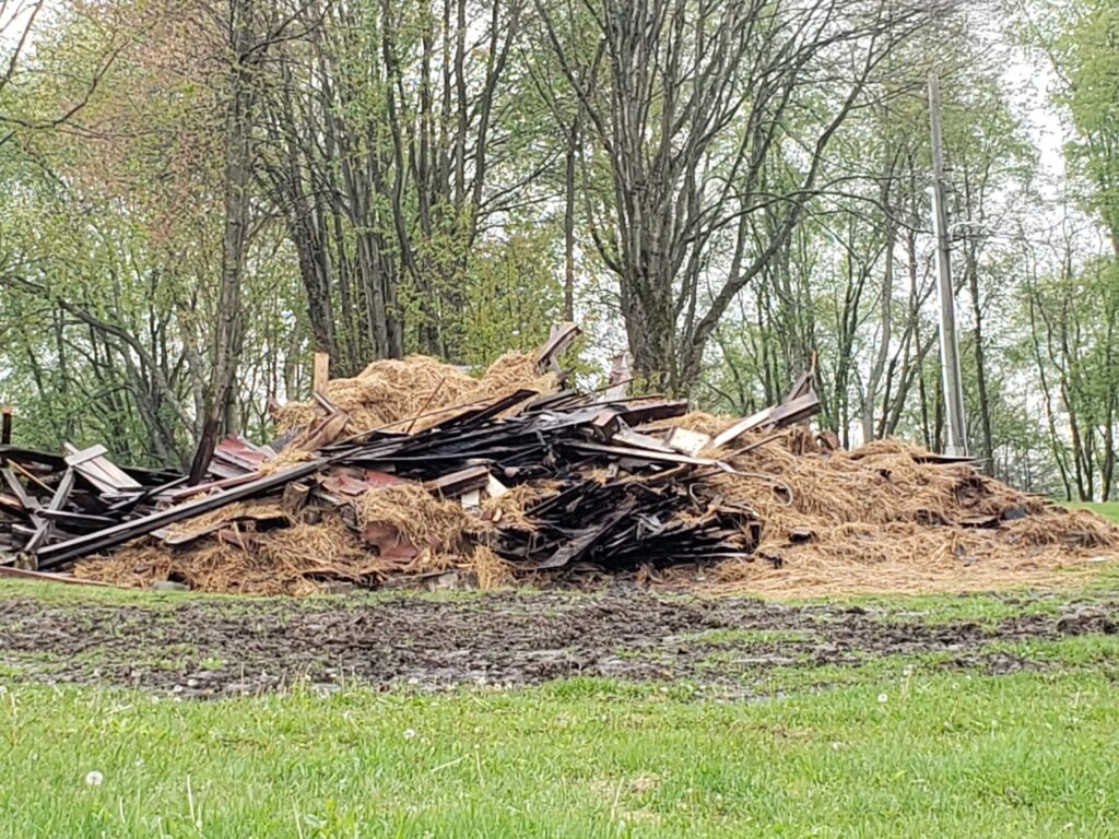 Pile of wood and hay debris outdoors