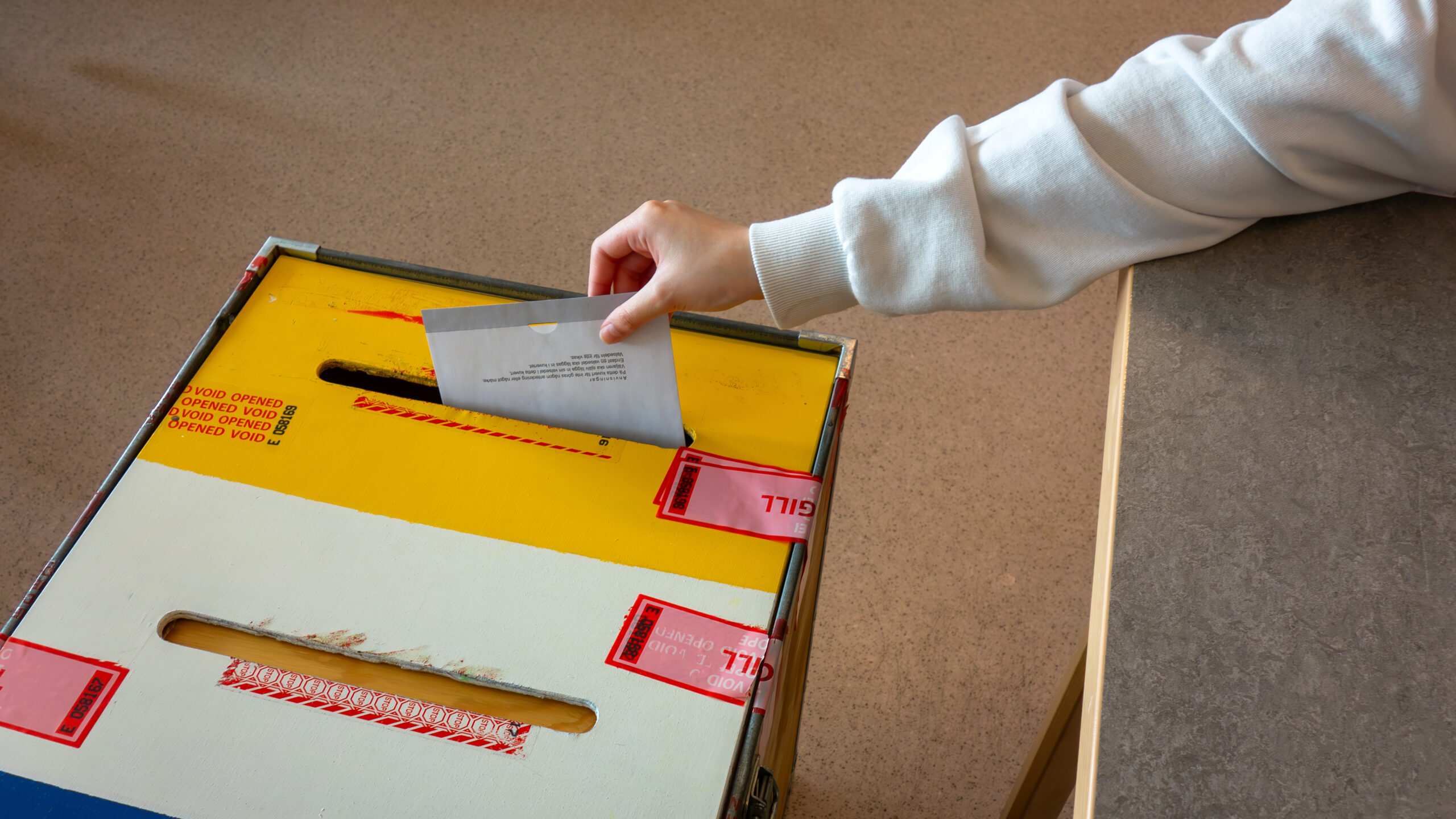 Ballot dropped into ballot box 2024 Swedish EU election at Stån