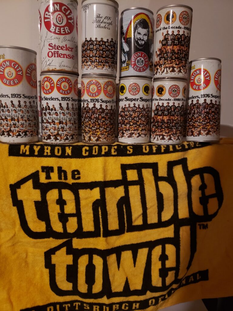 Vintage Iron City Beer cans on a Steelers Terrible Towel.