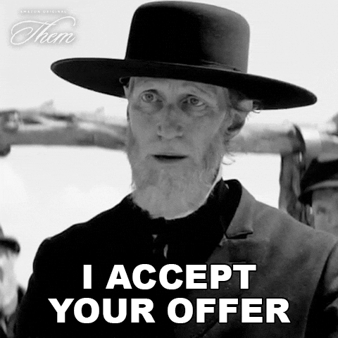 Man in a wide-brimmed hat saying I accept your offer.